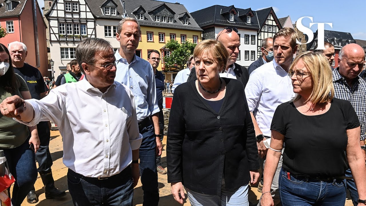 Merkel pledges financial aid at German flood site