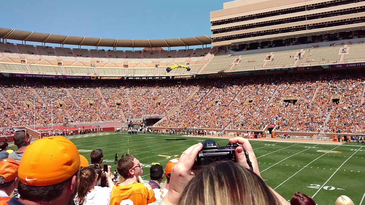 SEALS sky diving into Neyland Stadium, orange and white game 2016.