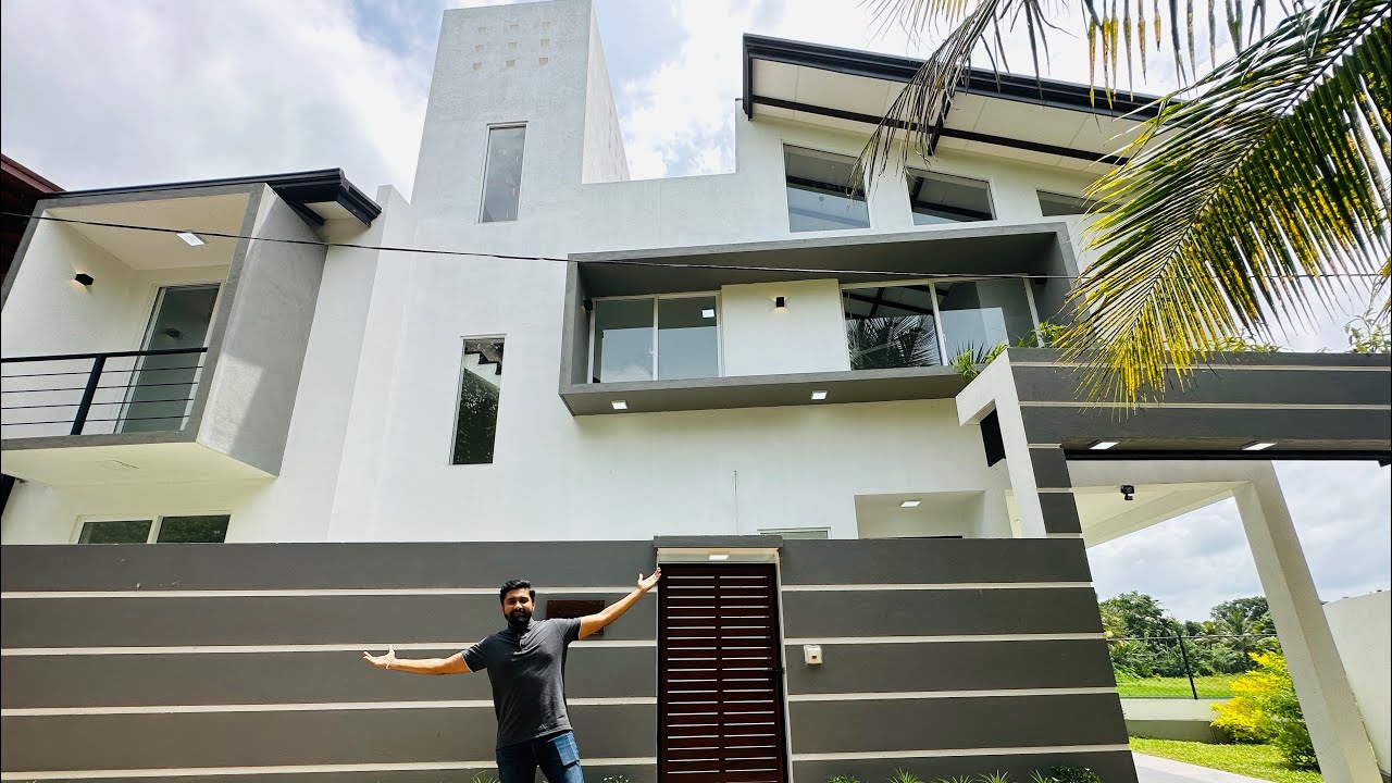 වෙල් යායකට මුහුණලා වෙනස්ම හැඩයකට ඉදි වුන නවීන නිවස | House for sale in Athurugiriya