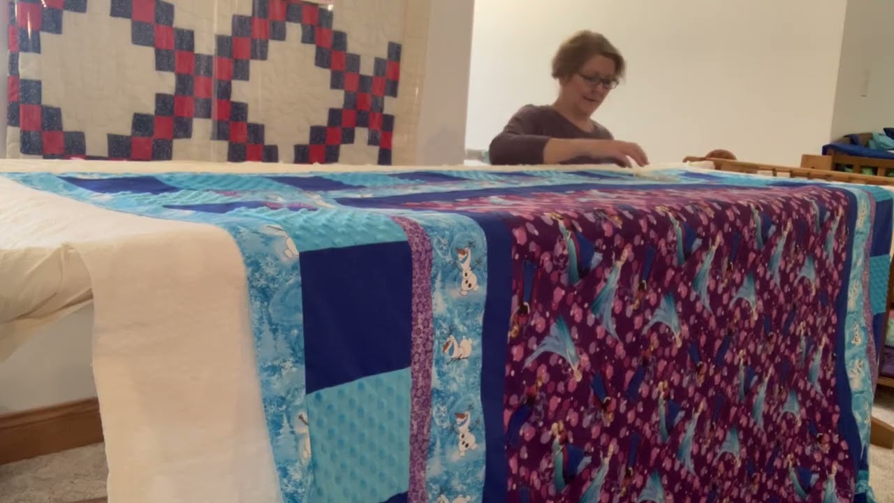 Putting the batting and Quilt top over the backing