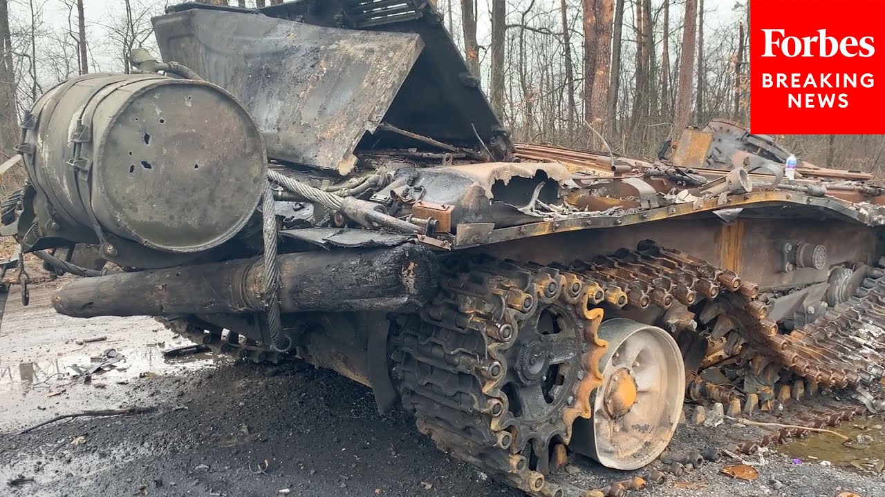 Ukrainian Soldiers Surveil Destroyed Russian Tanks In Bucha, Ukraine