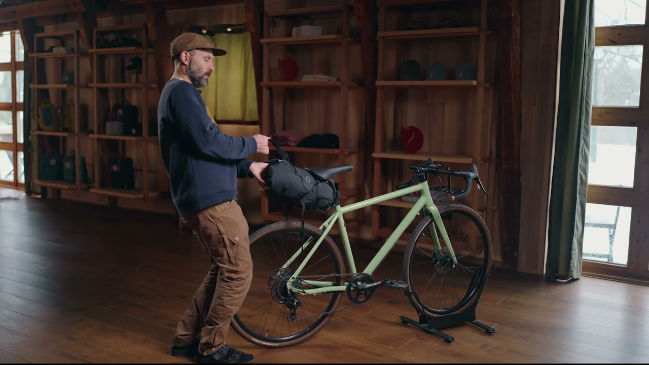 A unique solution to packing gear behind your saddle| Hoja Seatbag Harness and Drybags | Fjällräven