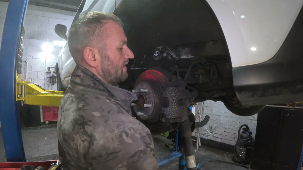How to Replace the Rear Shock Absorber on a Ford Transit Connect