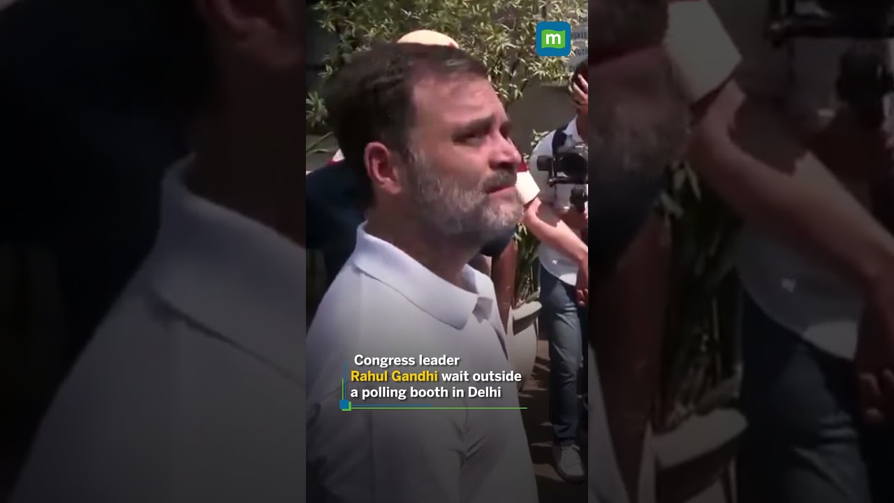 Congress leaderRahul Gandhi wait outside a polling booth in Delhi
