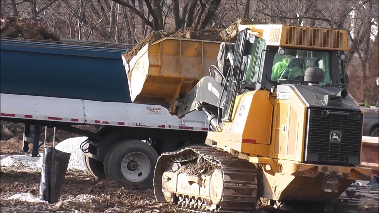 Track Loader and Excavator Combo In Action Digging Moving Dirt | John Deere