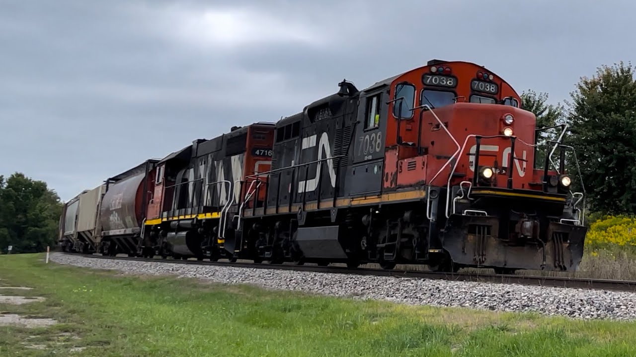 GP9! CN 568 rounds the bend at asphalt limited