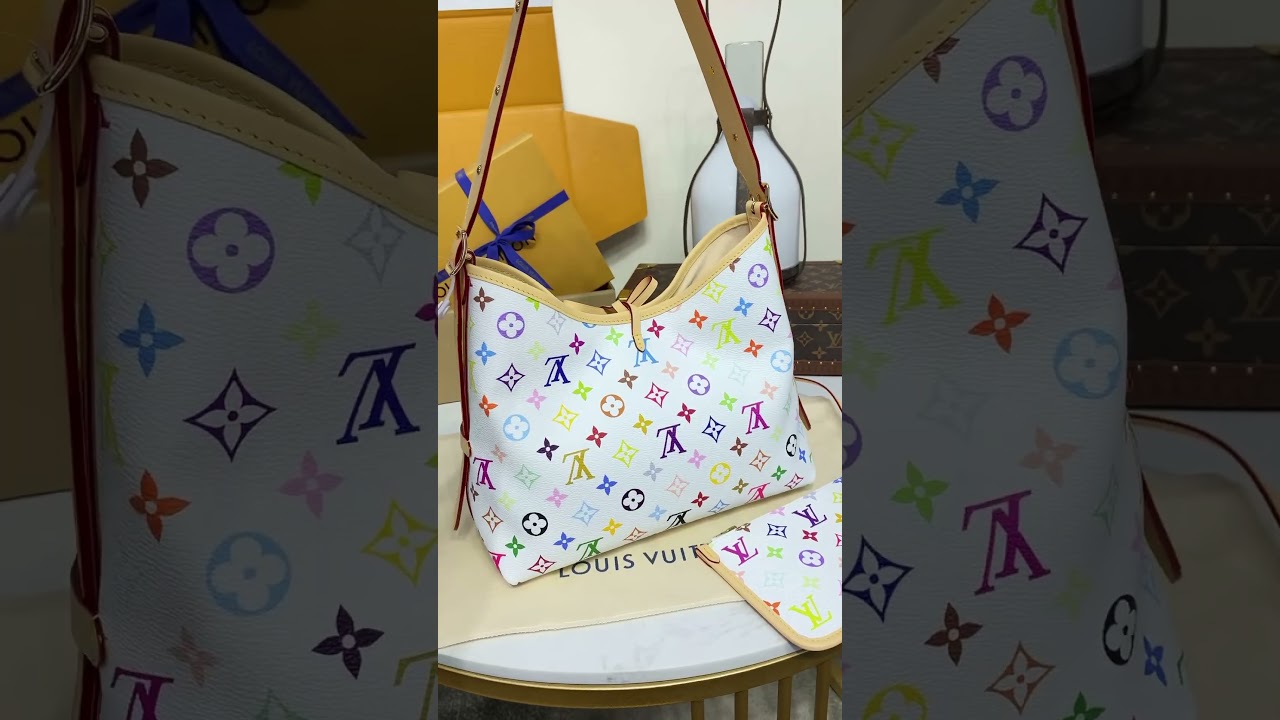 The LV x TM CarryAll bag is crafted in Monogram coated canvas withthe Japanese artist's vibrant hues