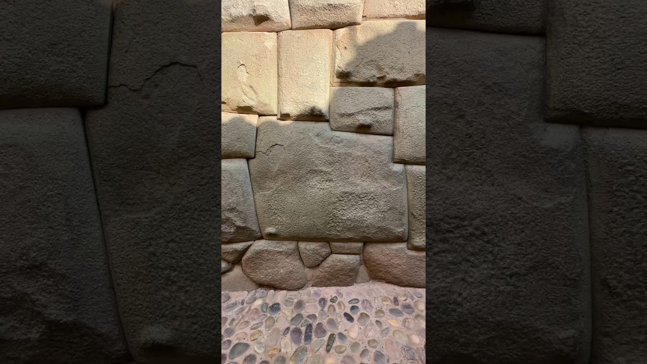 The 12-angled perfectly cut stone is an example of perfectionist Incan architecture in Cusco Peru