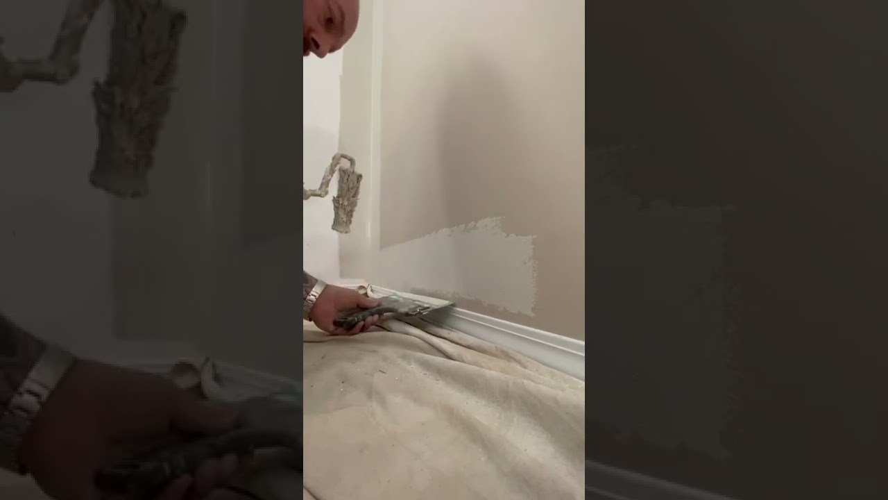 Cutting in paint to the baseboard tip