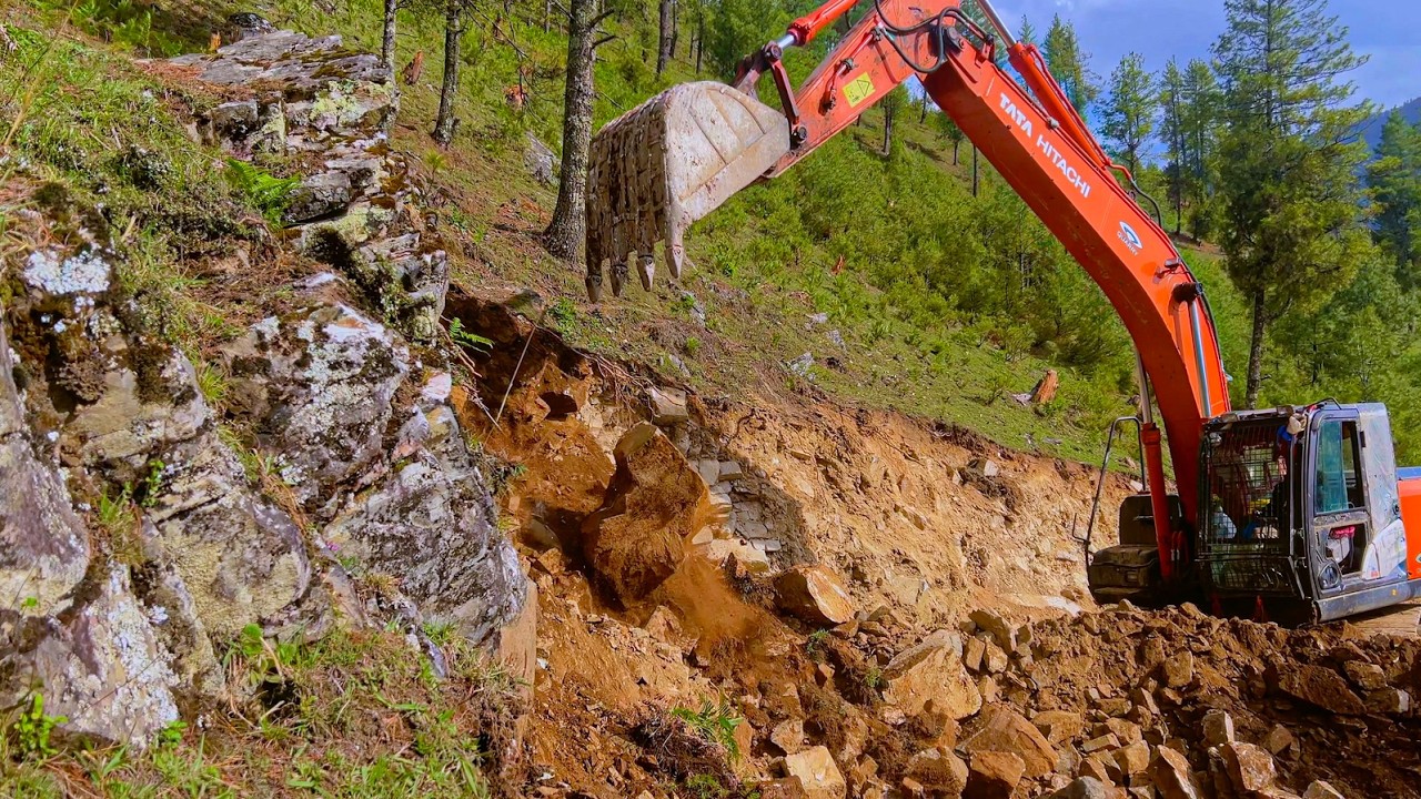 Excavator Backhoe Cutting Rocky Hillside to Build a Narrow Mountain Road | Heavy Equipment Work