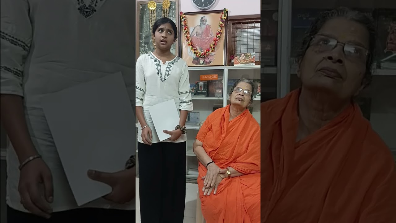 Manaswini  singing  a keertana before Swamini Sampannaananda Amma 22.02.2026
