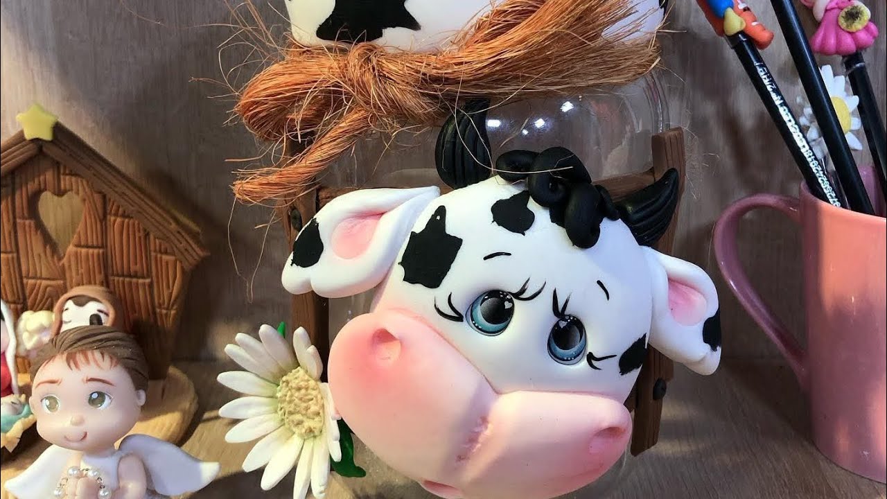 Pote decorado vaquinha de biscuit.
