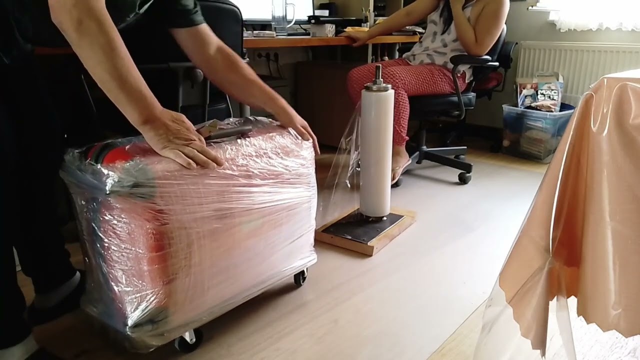Wrap your suitcase in stretch film at home, ready for loading