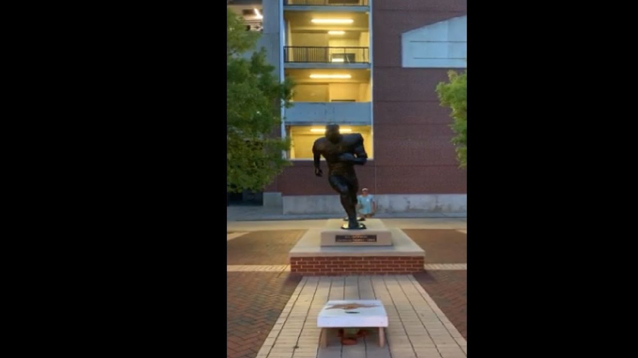 Man Throws Bags In Cornhole Over Bo Jackson Statue