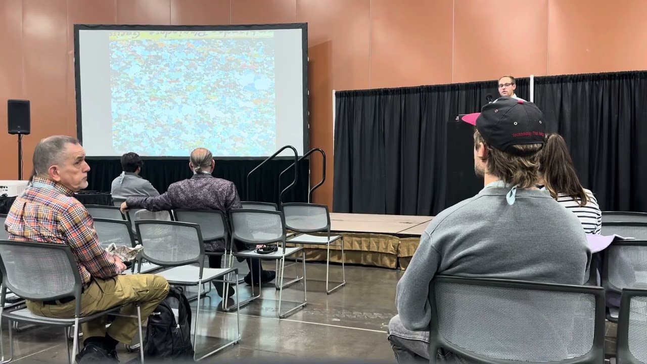 Mark Smith presents in the exhibit hall at the Entomological Society of America in Phoenix Arizona