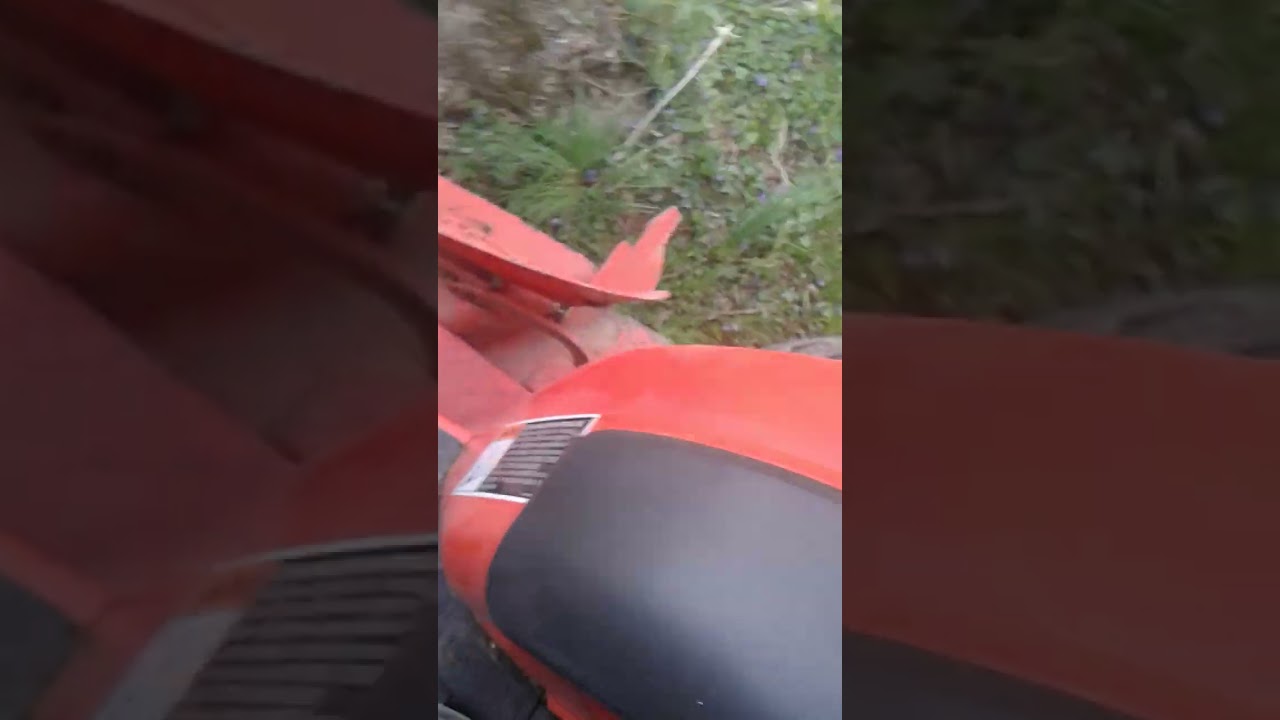 Kubota B2400 mowing.