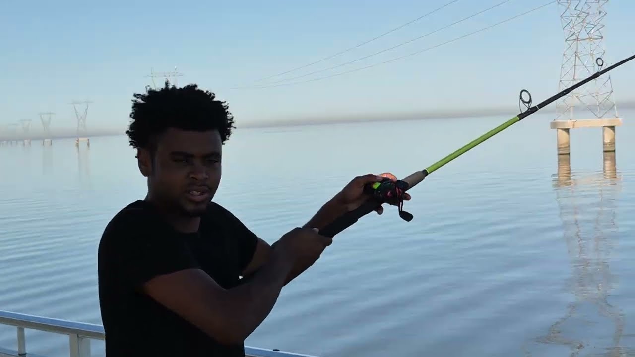 Tim catches a fish on Lake Ponchartrain, Louisiana.