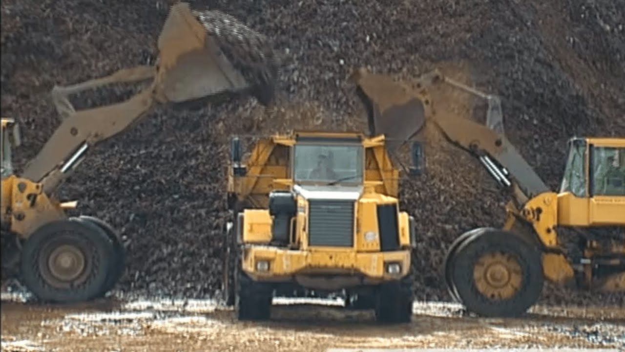 Scrap Metal Being Bullied and Loaded Onto A Big Cargo Ship, excerpt from Big Boats & Busy Harbors