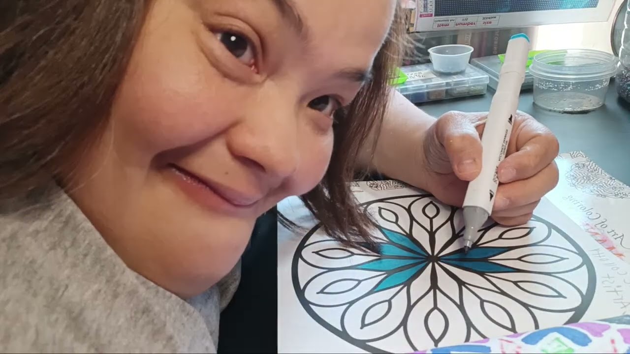 A coloring in my simple mandala bold and easy and Showing some completed one in the book 