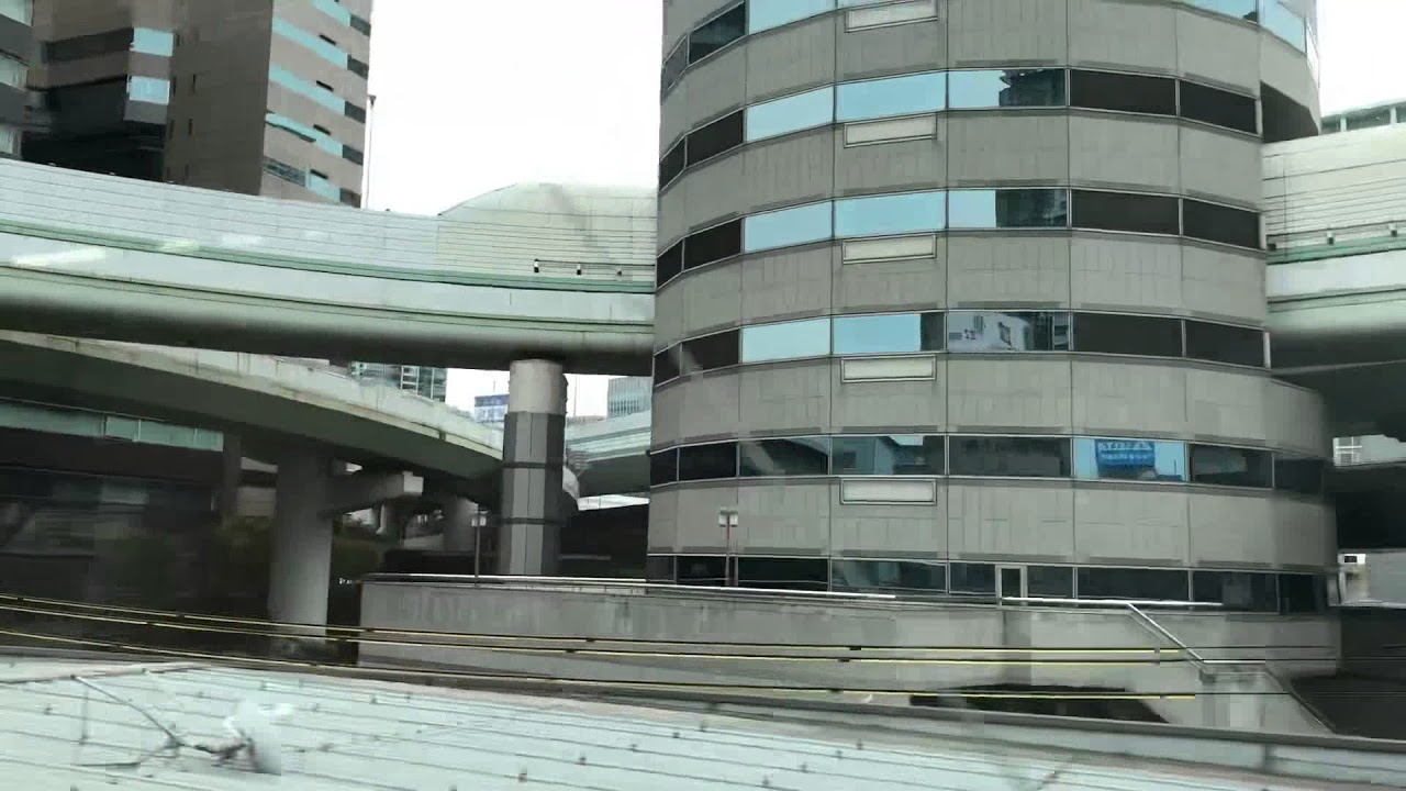 The Building In Osaka With A Road Going Through It