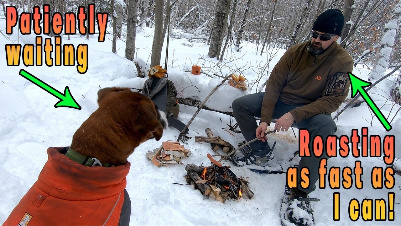 Wandering into the winter woods to start a fire without matches to roast some hotdogs with Argo