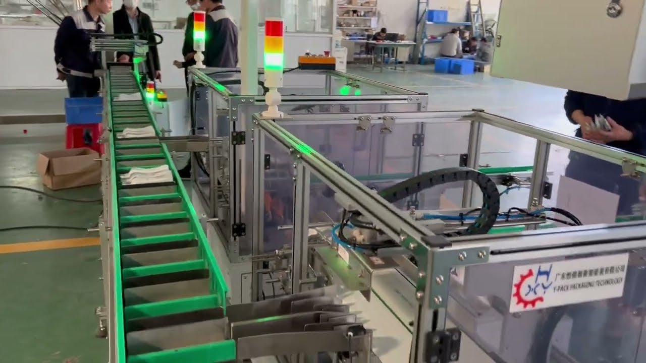 Automatic Infeed System for Fruit Juice Packaging Bag Spout
