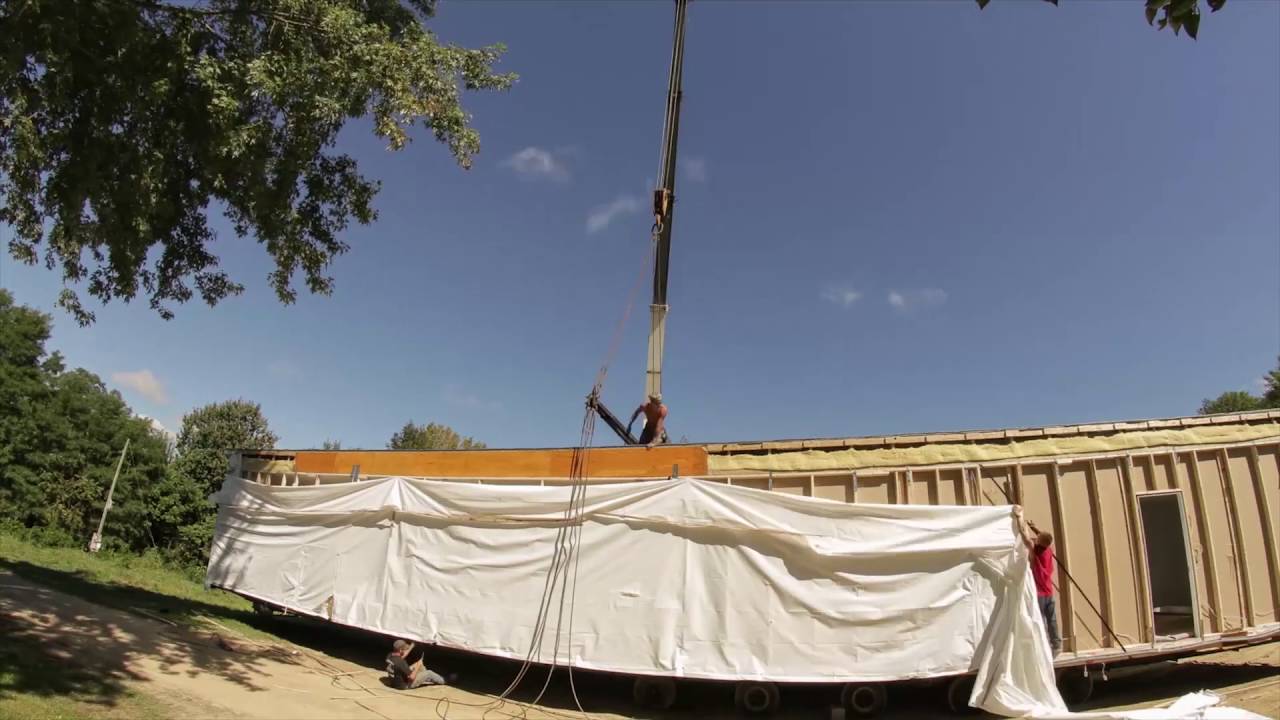 Didn't know you could do that!? Watch a mobile home crane lifted onto a basement foundation.