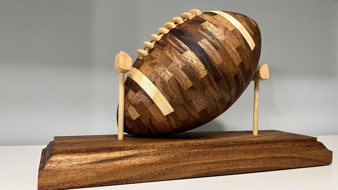 Can you find three error in this wooden Football  ???