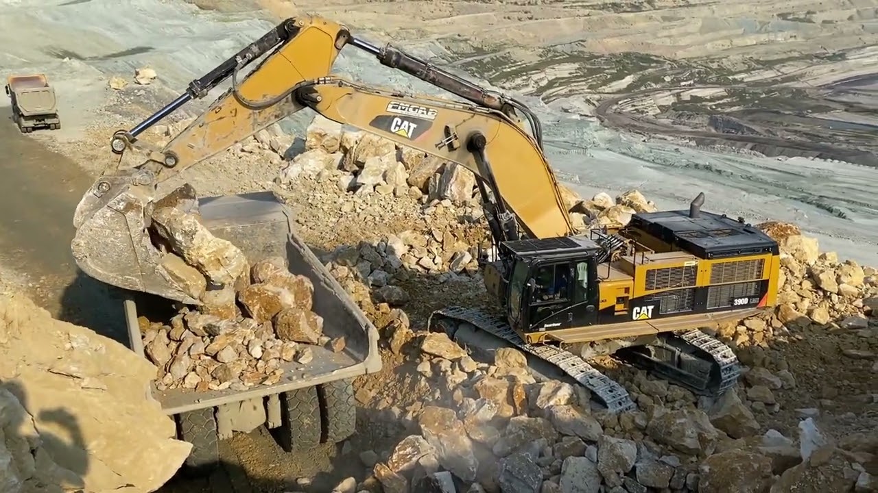 Caterpillar 390D Excavator Loading Caterpillar Dumper And Trucks - Pyramis Ate