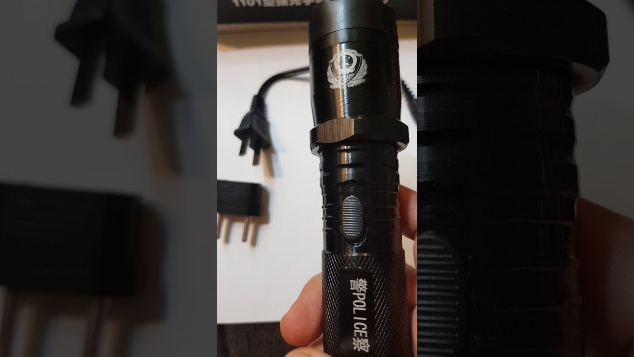 1101 Taschenlampe aus China mit Elektroschocker unter 15 €