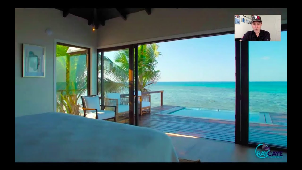 Stay on a private island resort in an overwater bungalow in Belize