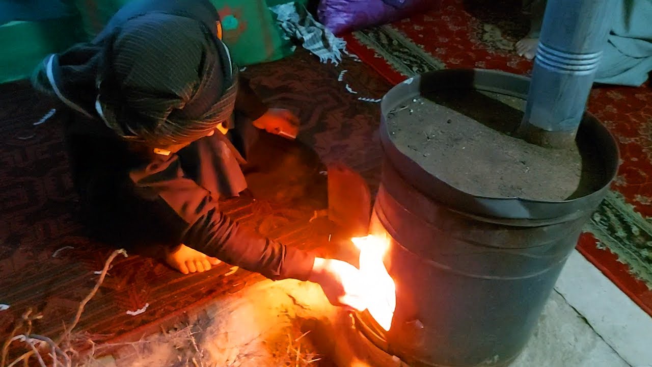 Afghanistan Village life - Turning on heater