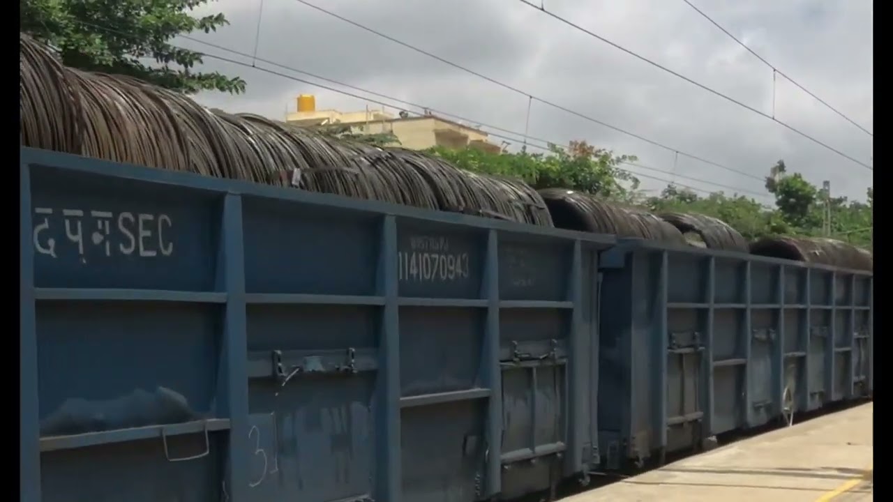 Electric Freight Train going slowly at Hoodi Halt