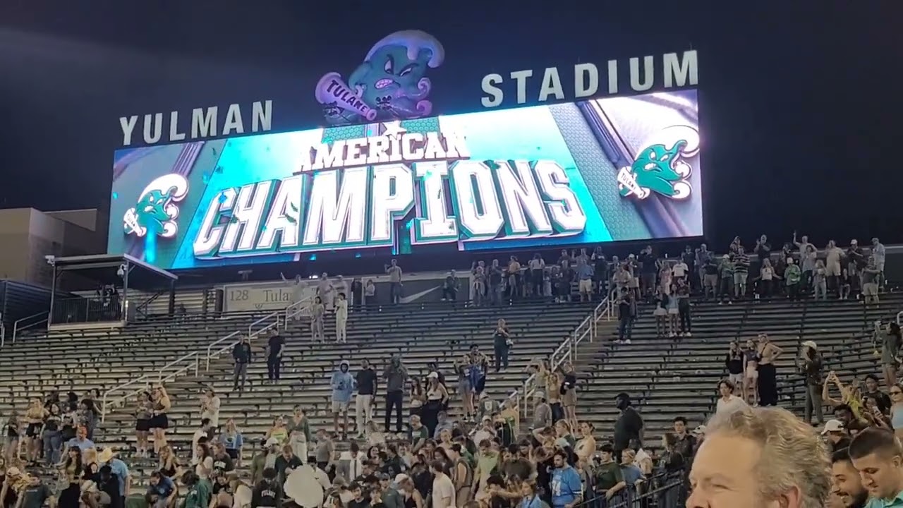 Students rush the field after Tulane wins the AAC conference championship