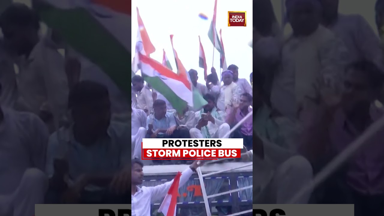 Watch: Bihar Protesters Climb Onto Police Bus Carrying Tejashwi Yadav in Patna #bihar #patna
