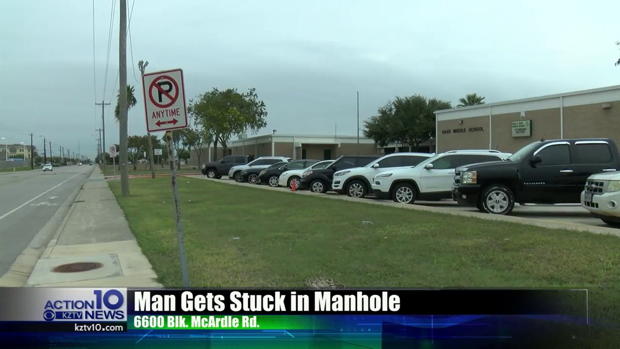 Man gets stuck in manhole trying to keep warm