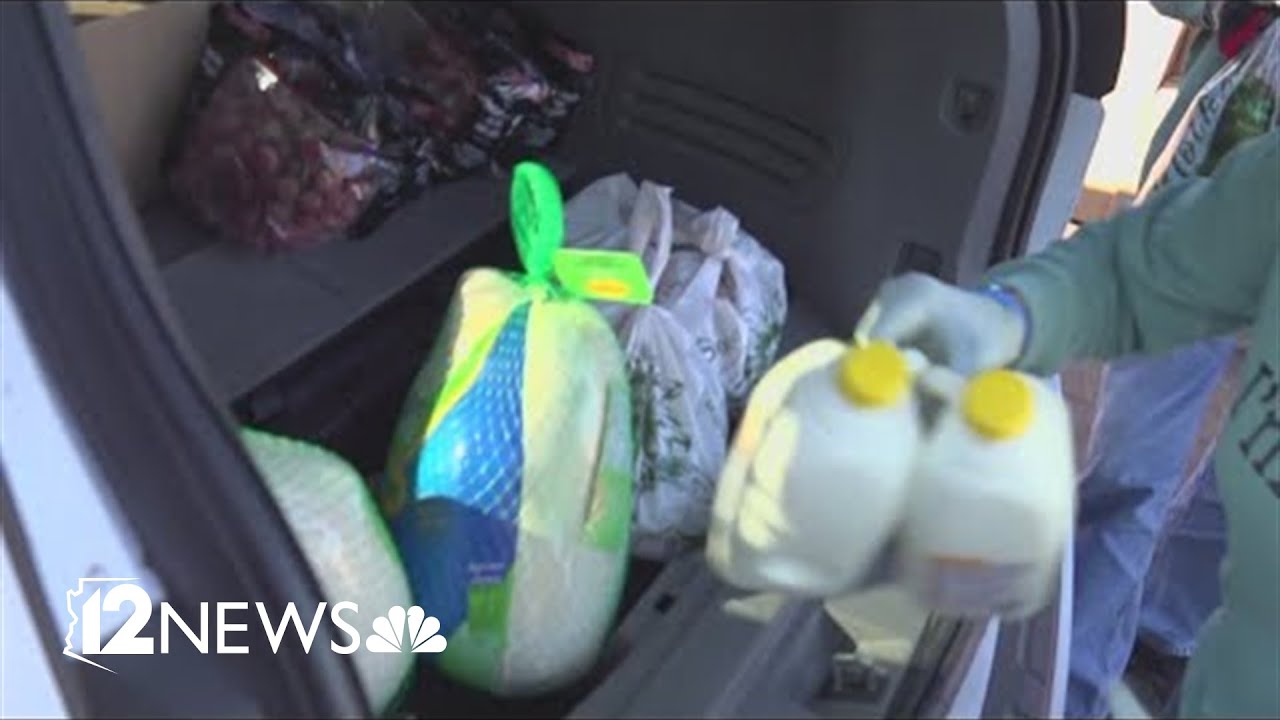 Hundreds of families line up for United Food Bank's Thanksgiving food distribution