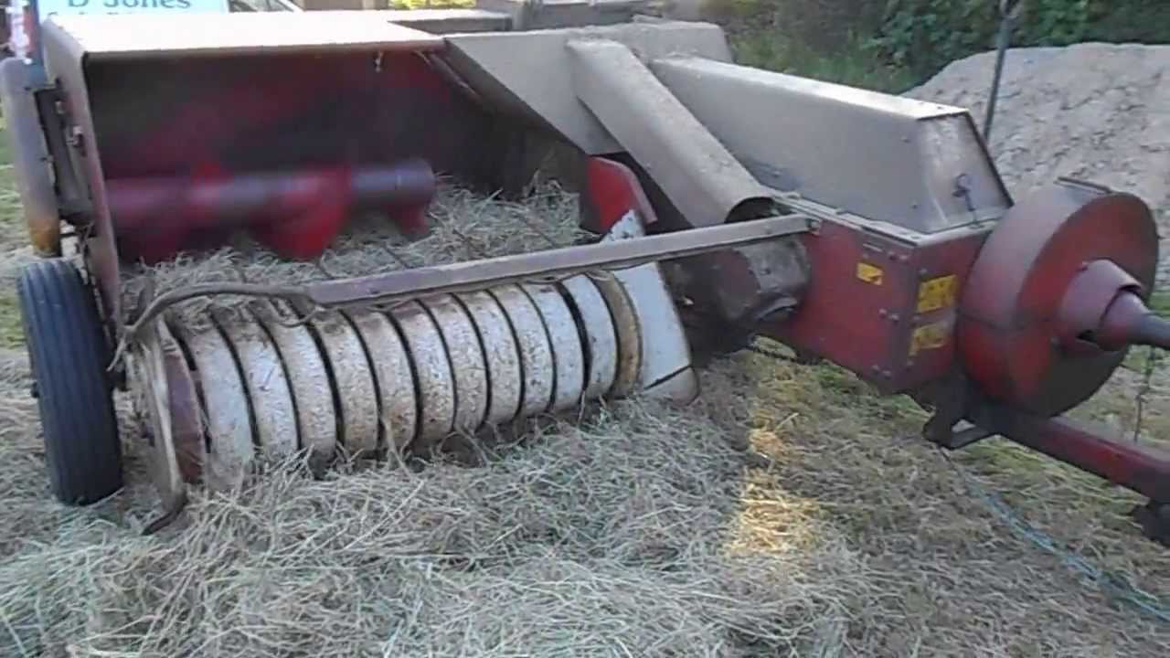 Massey Ferguson 135 baling with a B47 Baler