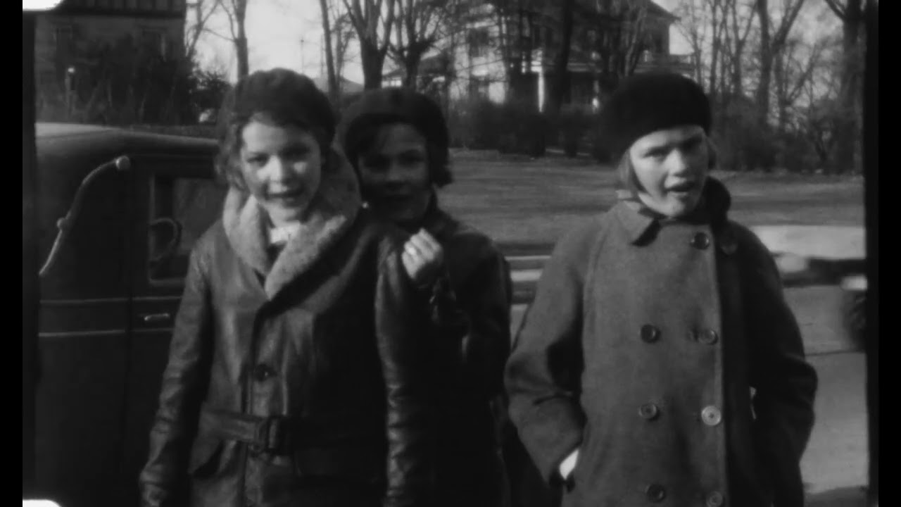 Three children roller-skating down South Main Street, Middletown, Ohio, circa 1930