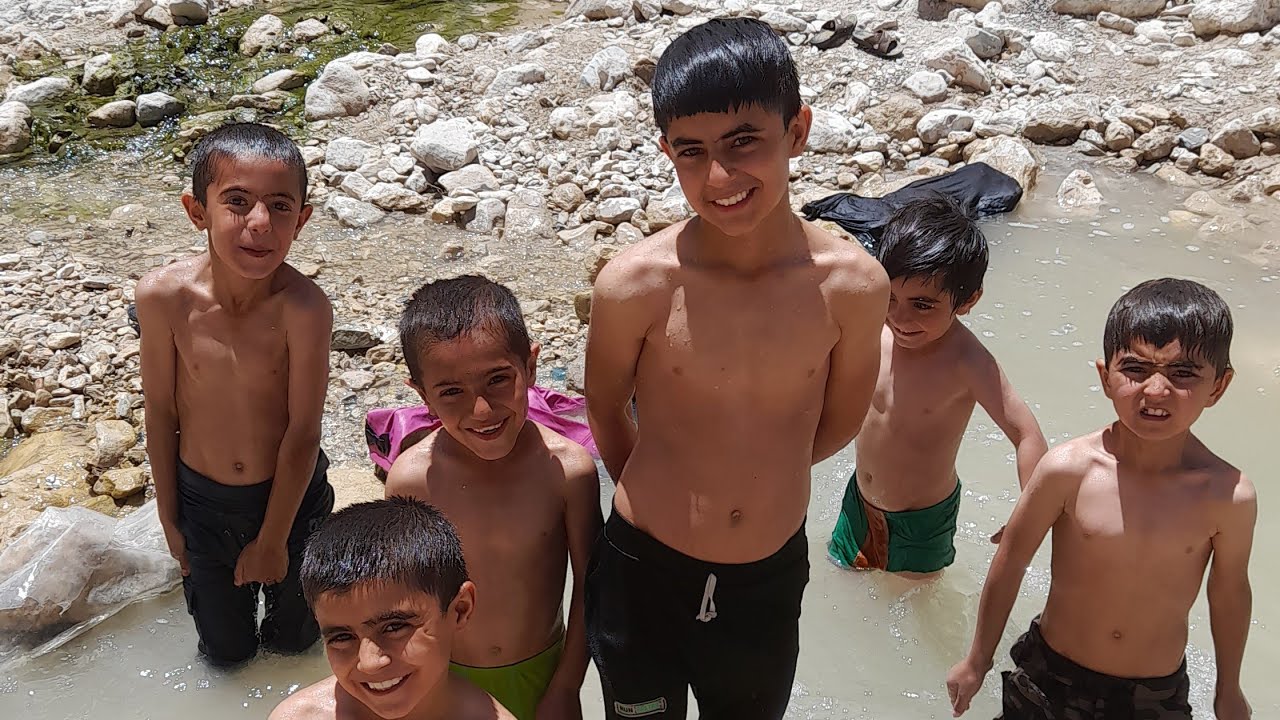Nomadic children build a swimming pool in the mountains[iran2023]