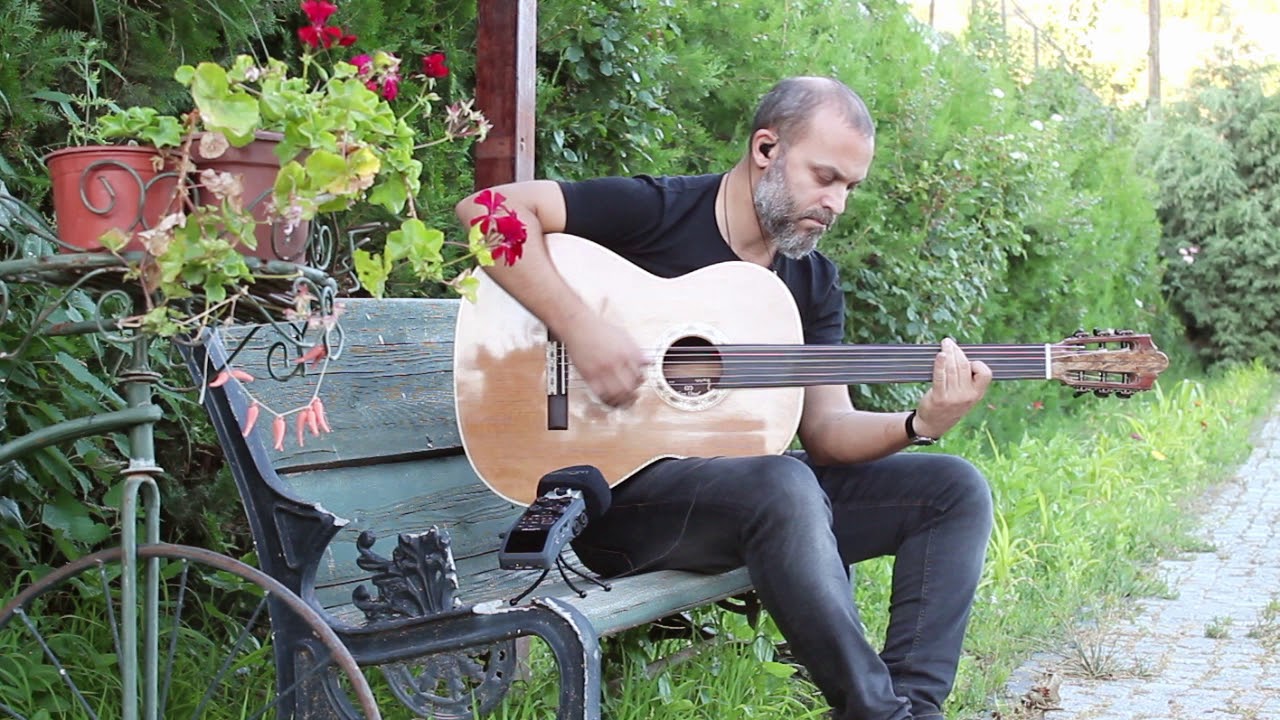 Cenk Erdogan  plays Baritone Fretless Acoustic Guitar