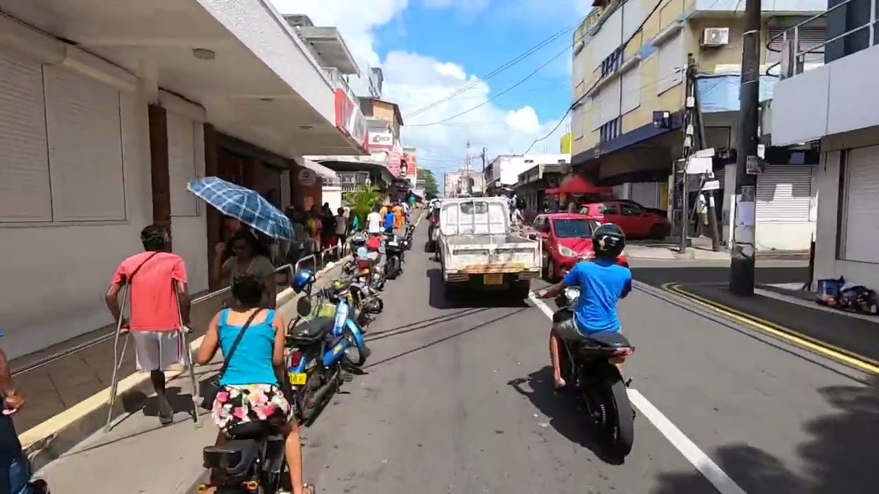 Cycling dangerous blue t-shirt motocycle at goodlands Mauritius pov