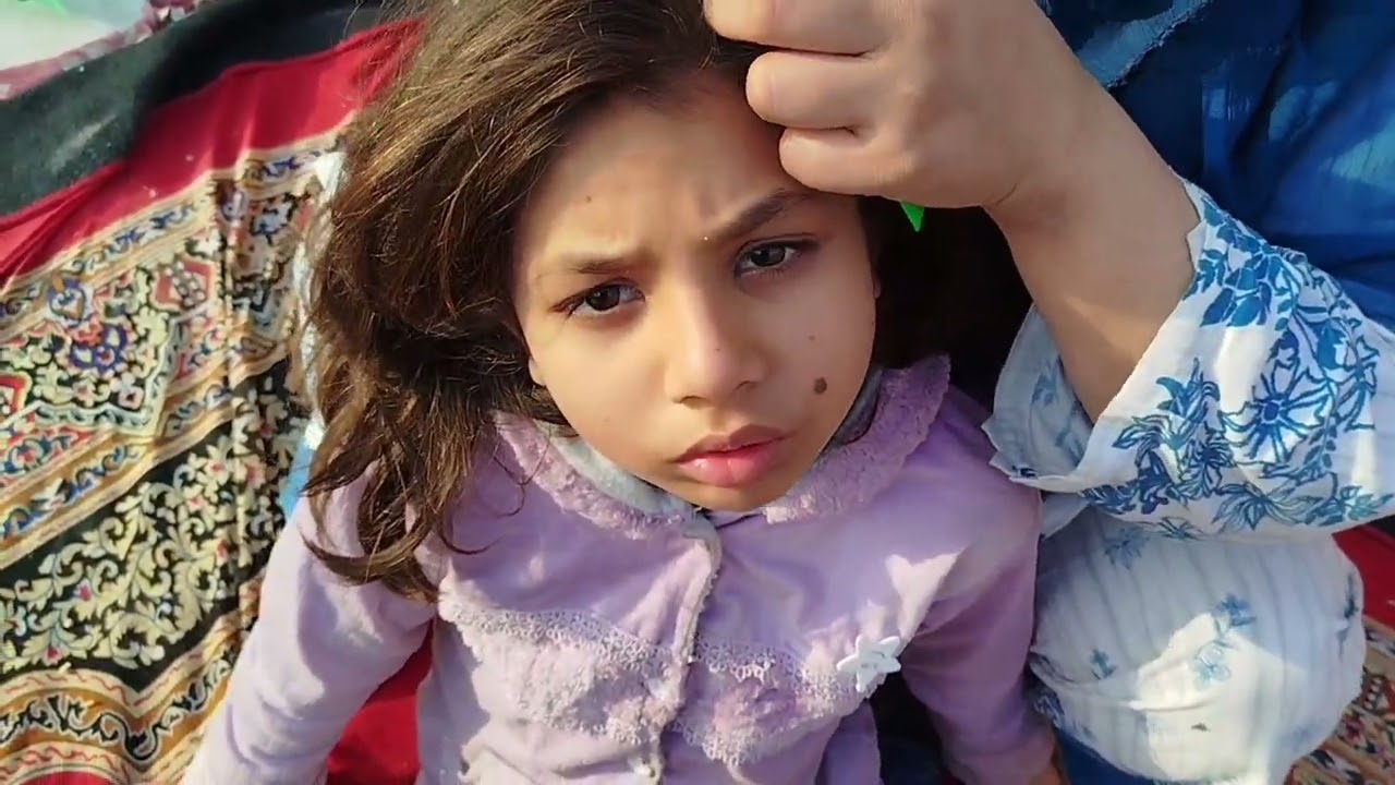 Hair checking of imaan by mom.