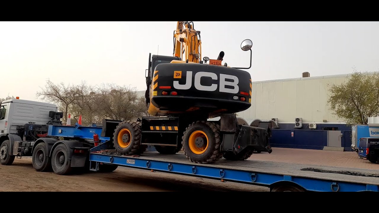 JCB JS200 Wheel Type Excavators Loaded To Trailers