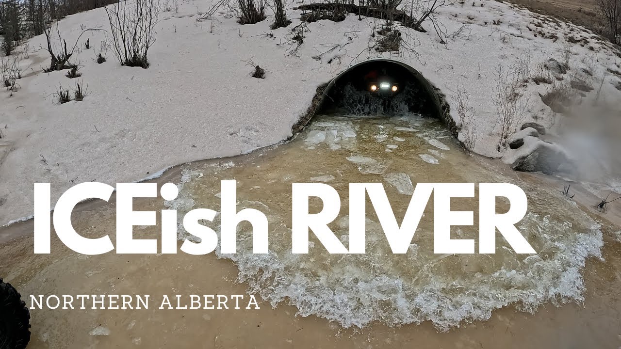 Northern Alberta, Icey, Slush and Snowy river run on ATV / Quad