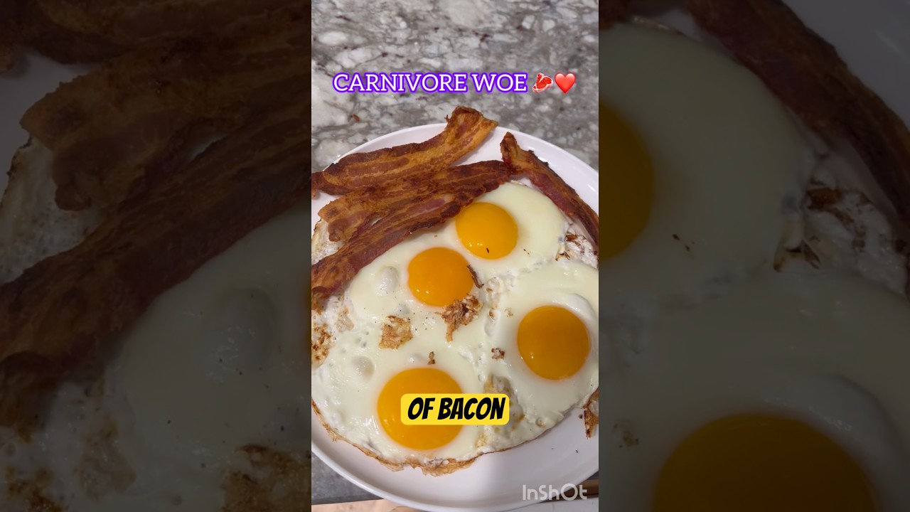 Fried bacon and eggs in a stainless steel pan  