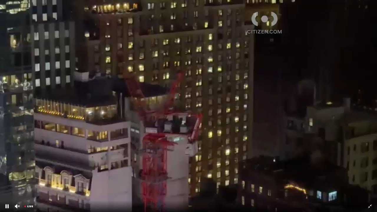 Construction crane spinning during high winds in Midtown