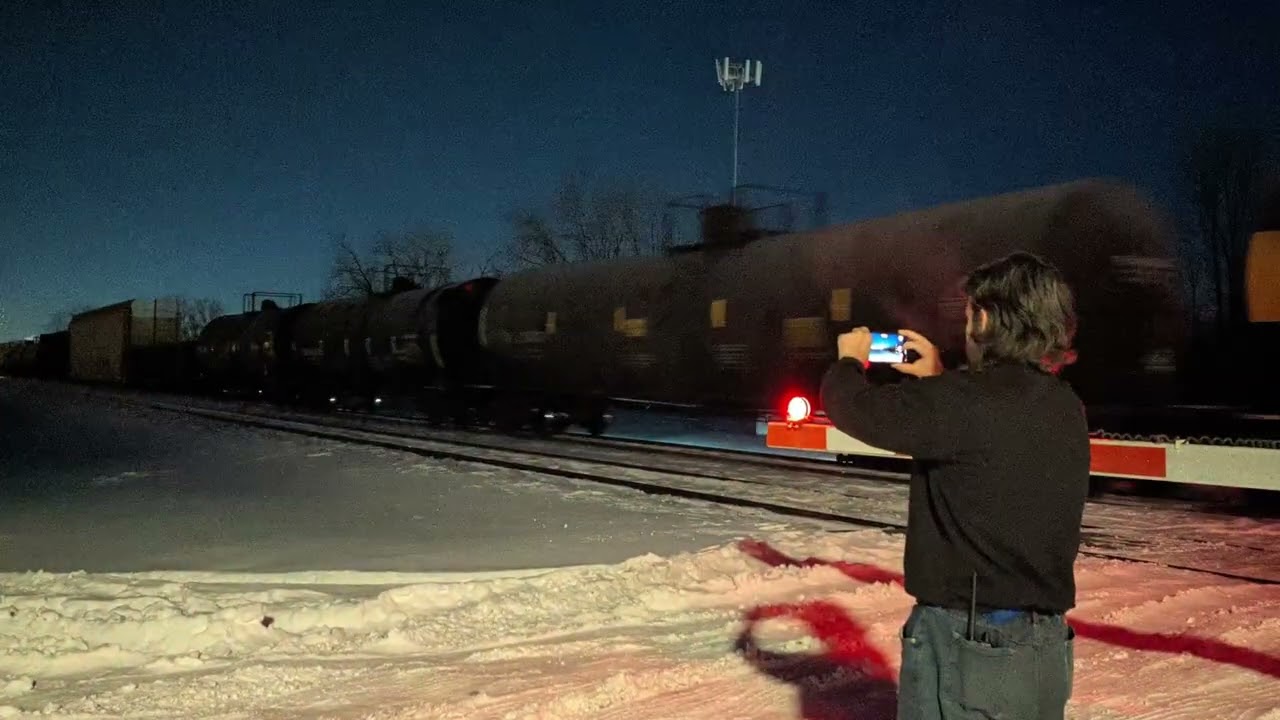 A 10,000 ft NS manifest train with a mid-train DPU.