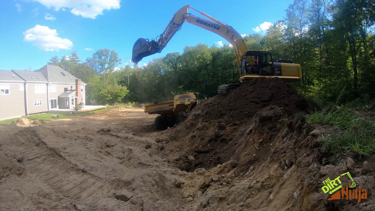 Komatsu PC360 Loading Haul Truck With Top Soil
