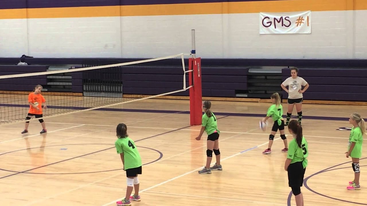8 year old with a powerful overhand serve in volleyball.